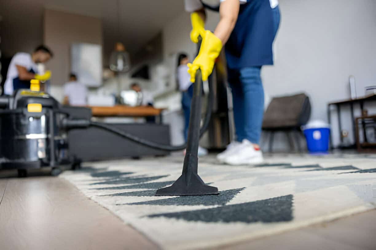 Do You Tip House Cleaners Tidyhere Image of Professional Cleaner Vacuuming a Carpet