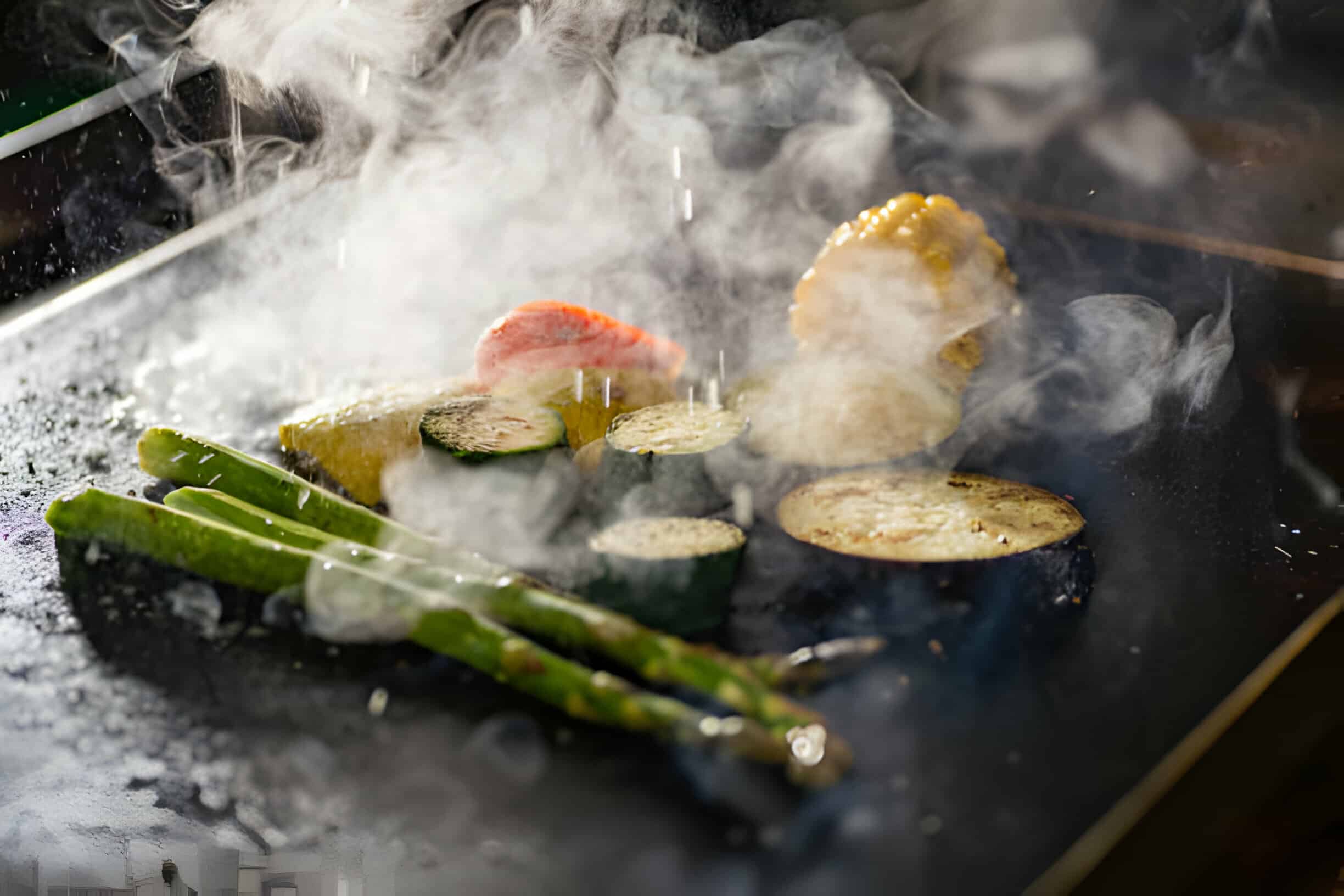 How to Clean a Blackstone Griddle Tidyhere  Image of Asparagus, Courgettes, Paprika and Corn Cooked on a Hot Griddle